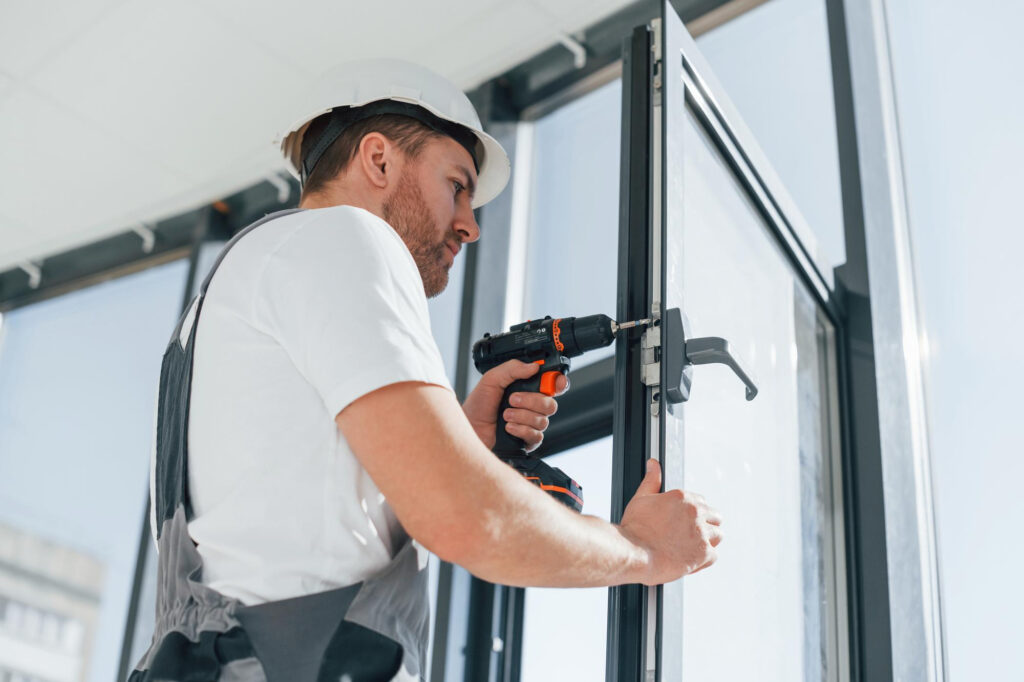 grey-uniform-repairman-is-working-indoors-modern-room